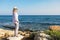 Businesswoman looking at view on ocean and thinking resting relax