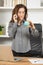 Businesswoman looking world globe and talking on phone