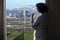 Businesswoman in Los Angeles Looking at Office Window