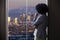 Businesswoman in Los Angeles Looking at Office Window