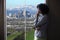 Businesswoman in Los Angeles Looking at Office Window