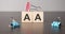 Businesswoman made word aa with wood building blocks
