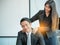 Businesswoman massaging shoulders to colleague