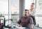 Businesswoman massaging shoulders to colleague at office. Office