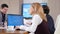 Businesswoman in meeting room with a laptop in front