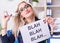 Businesswoman with message in office at desk