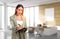 Businesswoman with notebook writing, manager room on background