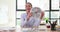 Businesswoman in office holding stylish wall clock