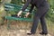 Businesswoman opens briefcase on a bench