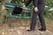 Businesswoman opens briefcase on a bench