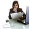Businesswoman with paper reports and laptop