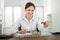 Businesswoman Placing Coin To Stack Of Coins