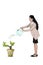 Businesswoman with plant and startup word