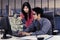 Businesswoman pointing dollar cash with her partner