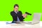 Businesswoman pointing gun to computer laptop sitting at office green chroma key