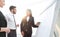 Businesswoman pointing marker to flipboard on presentation in office