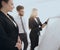 Businesswoman pointing marker to flipboard on presentation in office