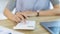 Businesswoman presses a calculator to calculate earnings and analyze company earnings in his private office