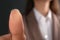 Businesswoman pressing control glass of biometric fingerprint scanner, closeup.