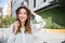 businesswoman putting biking helmet prepared cyclists around building go to work