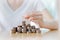 Businesswoman Putting Coin To Rising Stack Of Coins