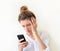 Businesswoman reads a notification on her mobile phone