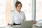 Businesswoman relaxing meditating in lotus position at office de