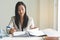 Businesswoman reviewing document in the office