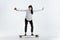 Businesswoman riding skate on white background