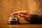 Businesswoman ringing hotel reception bell