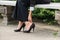 Businesswoman`s Hand Removing High Heels