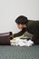 Businesswoman searching through rubbish bin