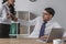 Businesswoman seducing colleague in office while