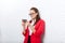 Businesswoman serious texting use cell smart phone wear red jacket glasses