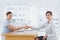 Businesswoman shaking hands with interviewee and both smiling at