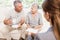 Businesswoman showing documents to senior couple