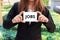 Businesswoman showing white sign with jobs word