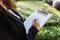 Businesswoman signing a life insurance policy on the street