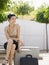 Businesswoman Sitting On Bench In Plaza