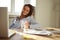 Businesswoman sitting at desk in her home office