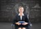 Businesswoman sitting on swivel chair with tablet