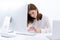 Businesswoman sitting at the table in office