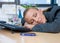 Businesswoman sleeping at her desk