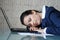 Businesswoman sleeping on laptop