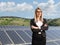 Businesswoman on a solar panel field