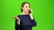 Businesswoman speaks on the phone and is angry with the interlocutor. Green screen