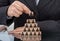 Businesswoman stacking wooden team blocks