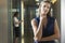 Businesswoman Standing In Office Corridor