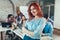 Businesswoman standing in office in front her colleagues