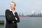 Businesswoman standing outside industrial site